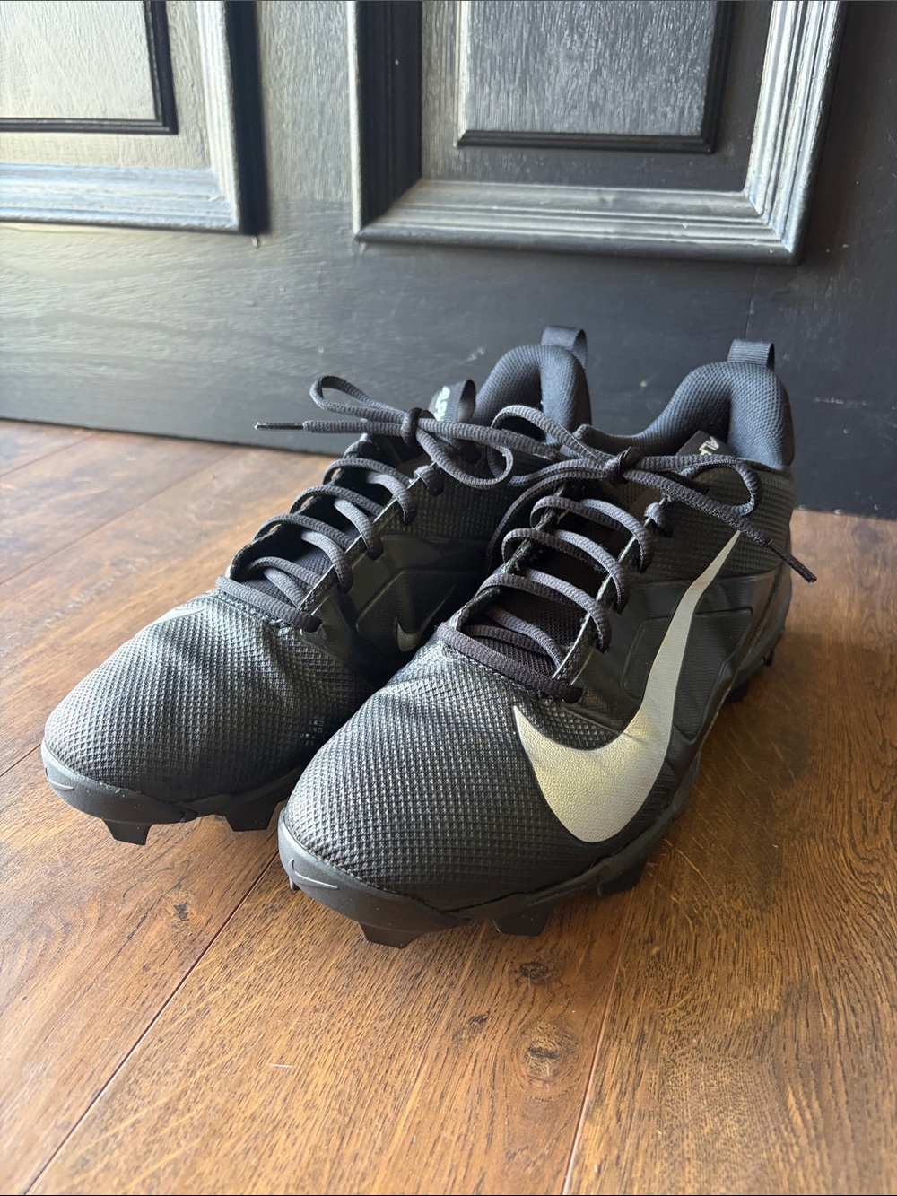Nike Men's Black Athletic Cleats with Silver Swoosh
